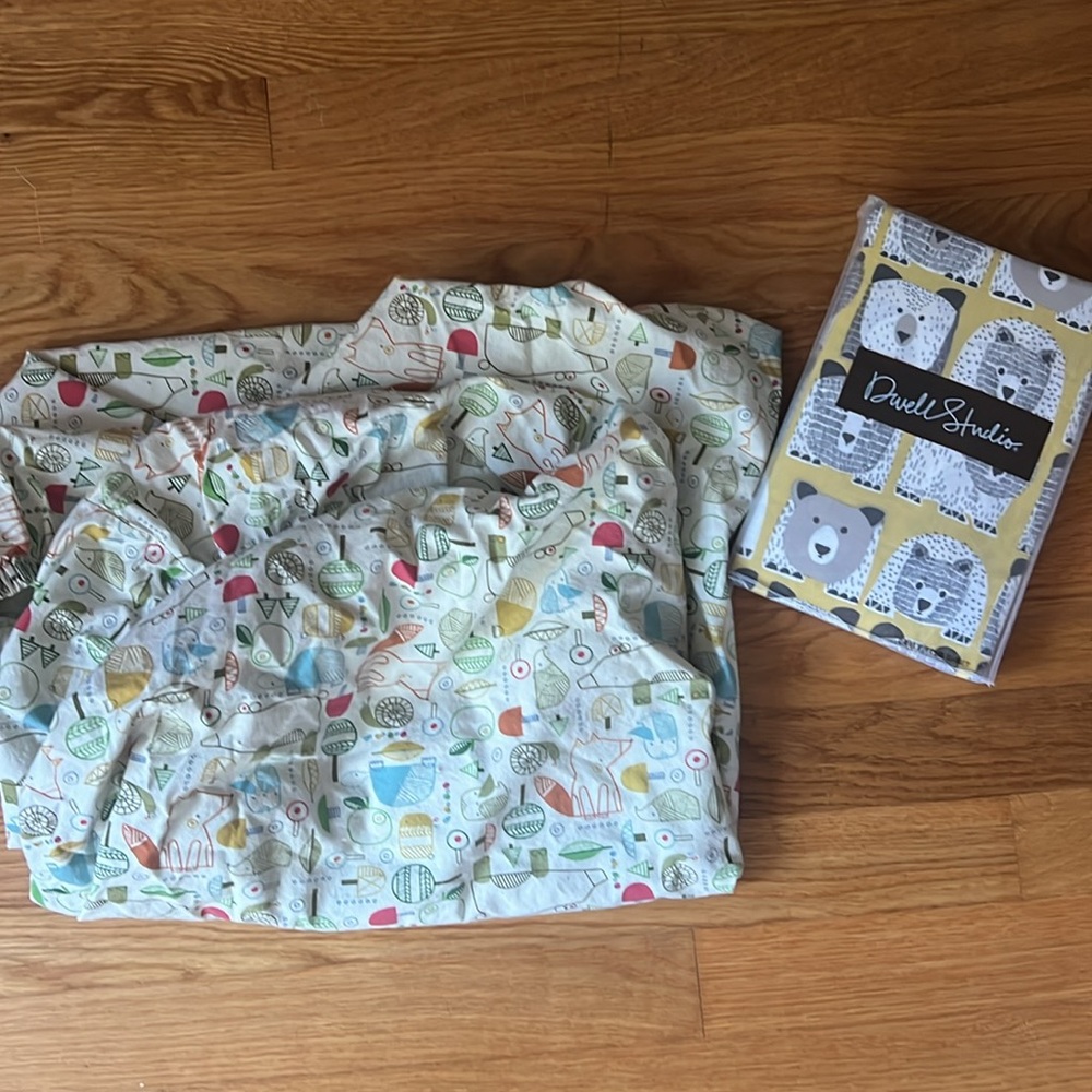 Dwell studio crib sheet, used land of nod sheet + naturpedic mattress protector